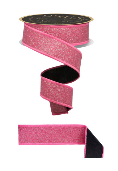 a pink glittery ribbon with a black border, and a black ribbon with a pink border.
