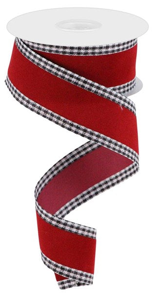 a roll of red and black checkered ribbon