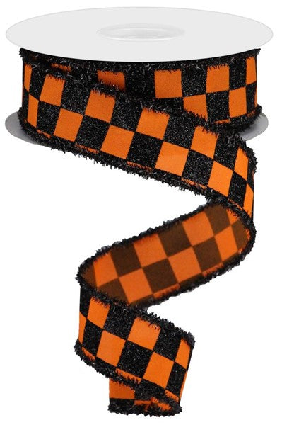 a roll of orange and black checkered ribbon