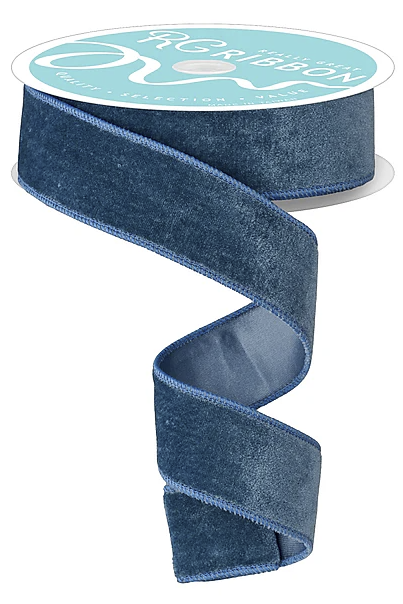 A roll of blue velvet ribbon with a white label.
