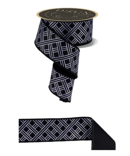 a black and white geometric patterned ribbon with a gold label.