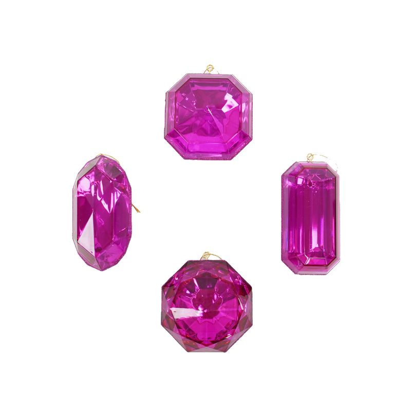 a group of three pink stones sitting next to each other