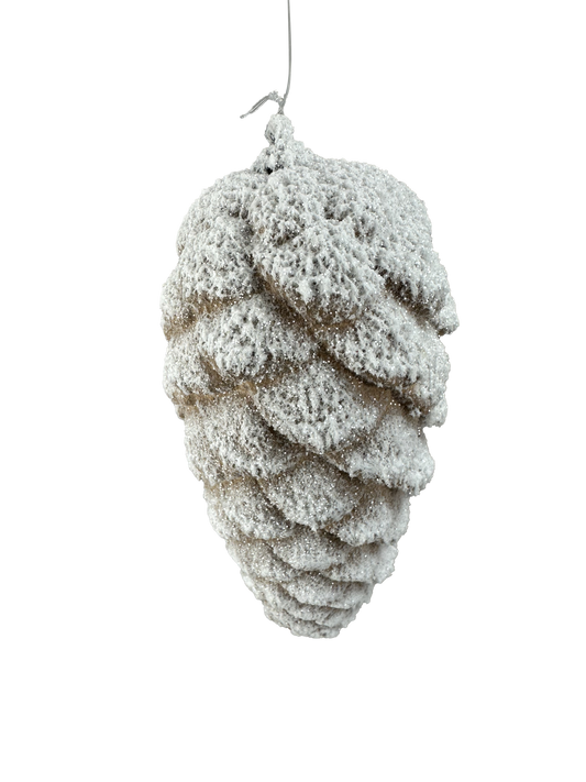 A close-up of a snow-covered pine cone, with its intricate and textured surface covered in a layer of white snow.