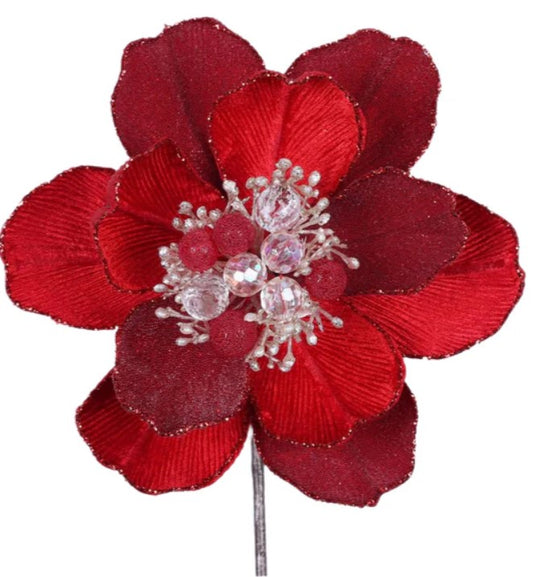 A large, red flower with a sparkling crystal center, surrounded by smaller red petals.