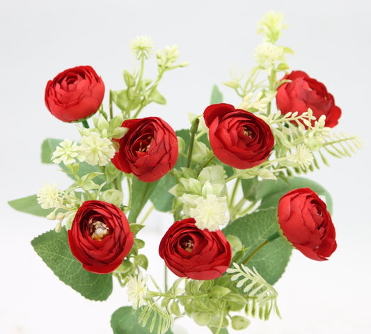 a bouquet of red roses and white flowers