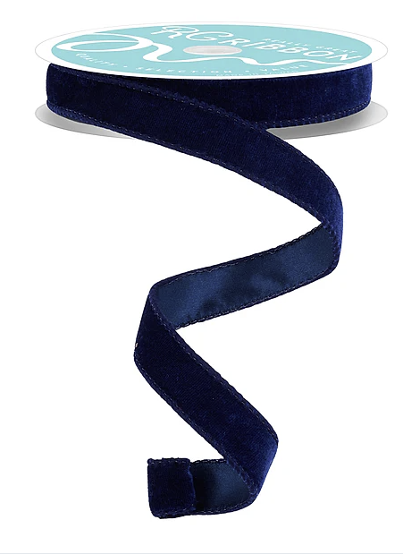 A roll of navy blue velvet ribbon with a white label.