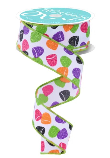 A colorful, multicolored ribbon with a pattern of various shapes and colors, including polka dots, stripes, and dots.