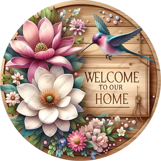 a welcome sign with flowers and a bird