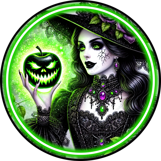 a woman in a witches costume holding a green apple