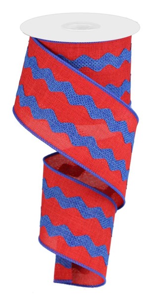 a roll of red and blue ribbon on a white background