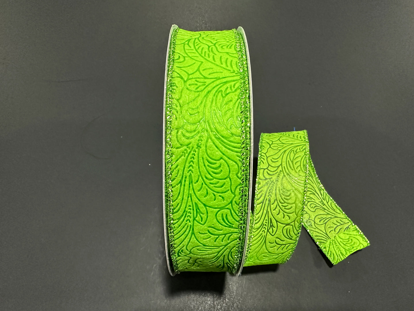 a pair of neon green ribbon sitting on top of a table