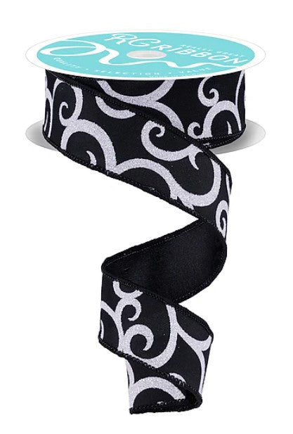 a black and white spiral-patterned ribbon with a turquoise label.