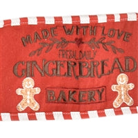 a red and white banner with gingerbreads on it