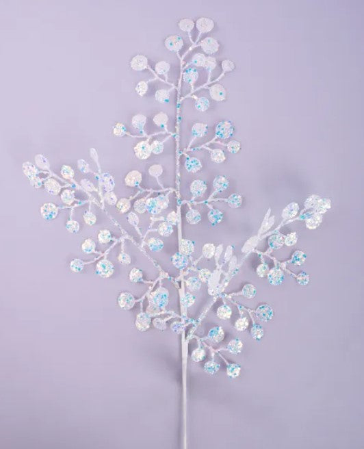 A white branch with small, round, and blue-colored flowers or leaves attached to it, creating a delicate and intricate floral design.