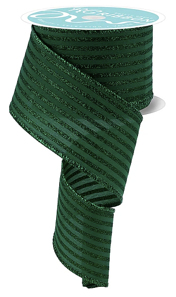 a green ribbon with a metallic sheen, coiled and hanging on a white spool.