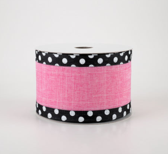 a roll of pink and black polka dot ribbon