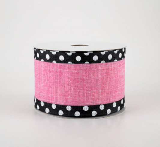 a roll of pink and black polka dot ribbon