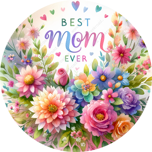 The image is a vibrant and colorful floral arrangement with various flowers, including roses, peonies, and daisies, all set against a light background. The text "BEST MOM EVER" is prominently displayed in the center of the image, surrounded by hearts and flowers.