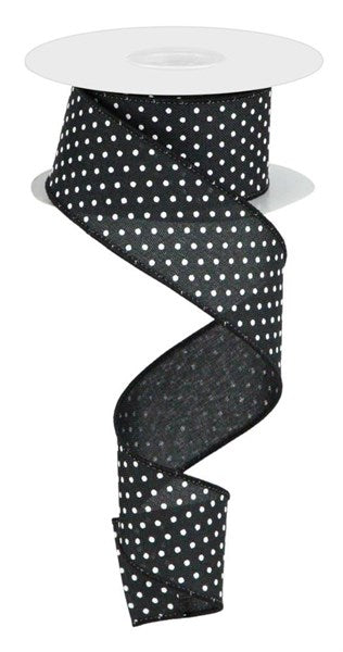 a roll of black and white polka dot ribbon