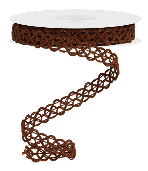 a white table with a brown ribbon on top of it