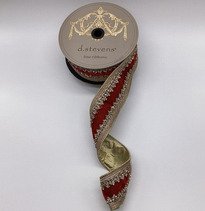 A spool of ribbon with a decorative pattern of red and gold trim, placed on a white background.