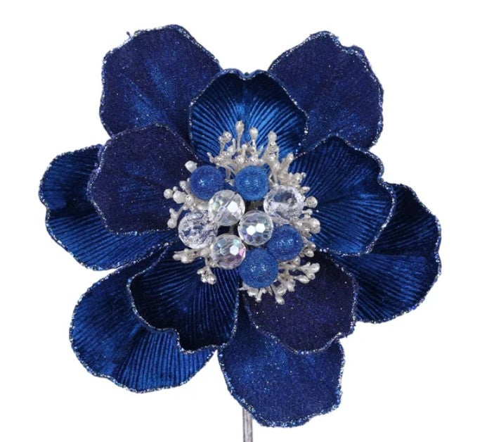 A close-up view of a blue flower with a sparkling crystal center, showcasing its intricate details and vibrant color.