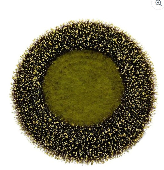 The image is a circular arrangement of small, black and yellow objects that create a textured, spiky appearance.