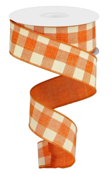 A spiral-shaped orange and white checkered ribbon is shown against a white background.