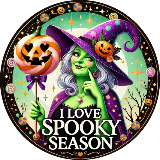 a picture of a witch holding a pumpkin