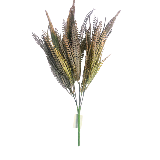 A bunch of fake grass or artificial plant leaves, with a green stem and brown and yellow colors, is shown against a white background.