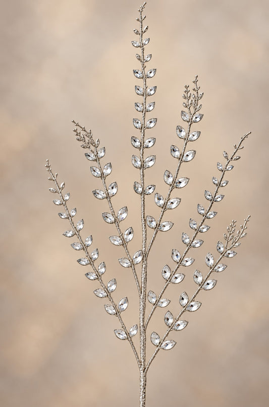 A decorative branch made of small, clear glass or crystal elements, creating a sparkling, elegant appearance.