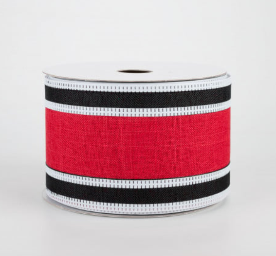 a roll of red and black ribbon on a white background