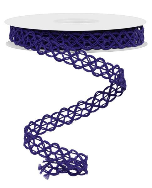 a roll of purple ribbon on a white surface