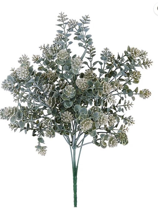a bunch of green leaves and flowers, possibly artificial, arranged in a cluster.