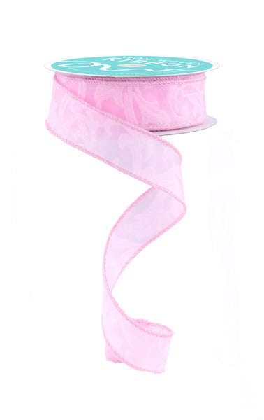 A pink ribbon with a turquoise label is shown against a white background.
