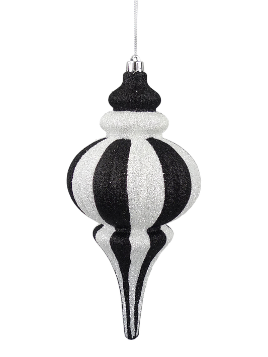A black and white striped ornament with a pointed top and a long, thin body.