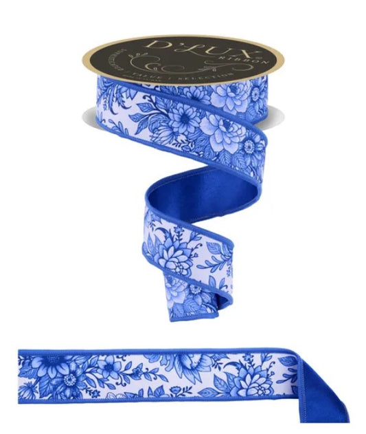 a blue and white floral patterned ribbon with a black and gold label.