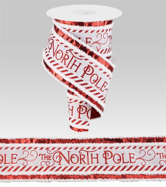 a red and white ribbon with the words north pole on it