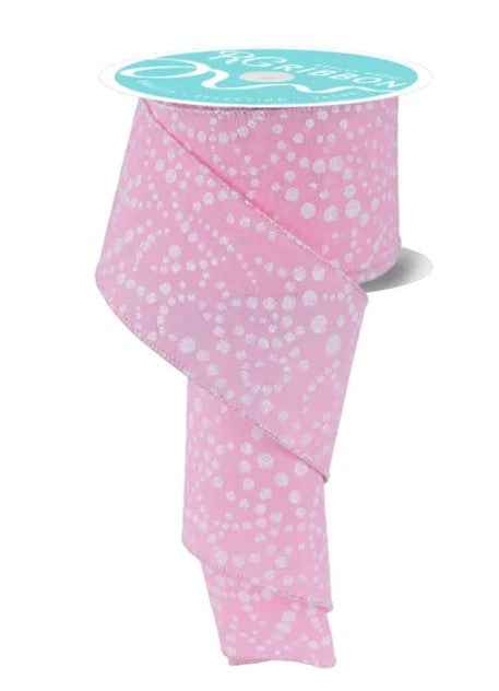 a pink and white polka dot ribbon with a turquoise label.