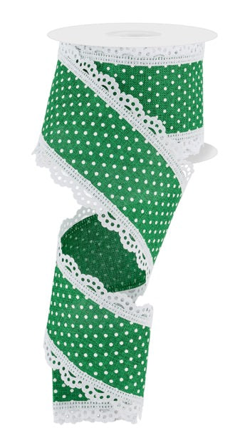 a roll of green and white polka dot ribbon
