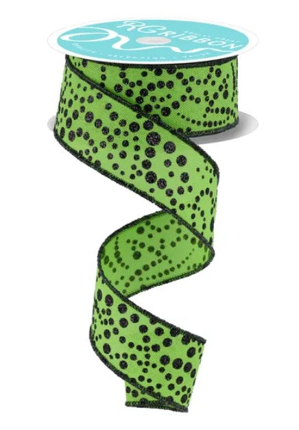 A spiral-shaped green and black polka dot ribbon is shown against a white background.