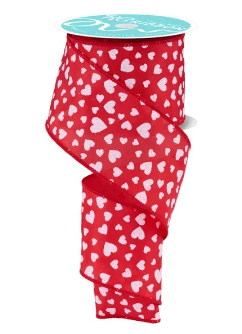 a red ribbon with a white heart pattern.