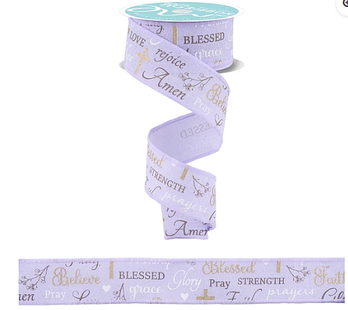 a roll of purple ribbon with words on it