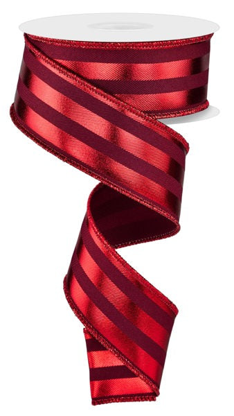 a roll of red satin ribbon on a white background