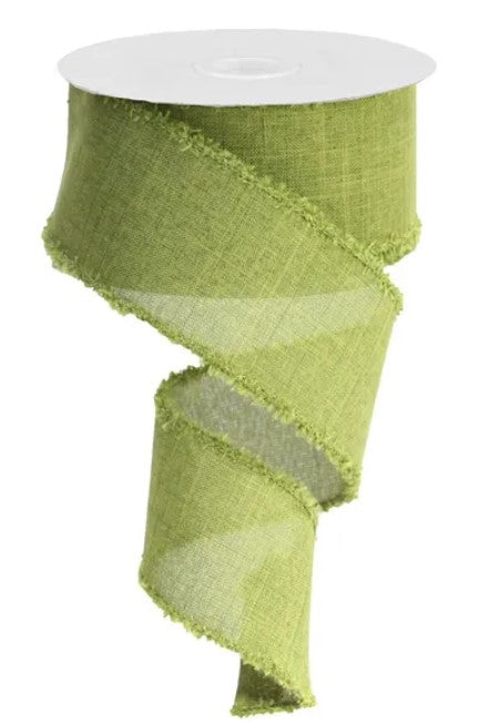 A roll of green fabric ribbon with frayed edges.