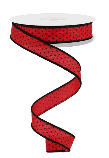 a red ribbon with black dots on it