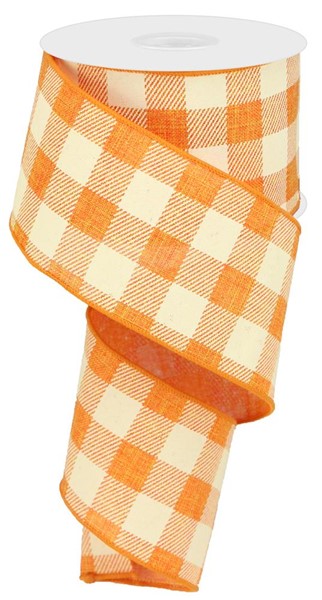 a roll of orange and white checkered ribbon