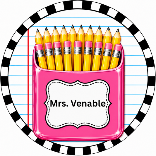 A pink pencil holder filled with yellow pencils, labeled "Mrs. Viable" in a decorative frame.