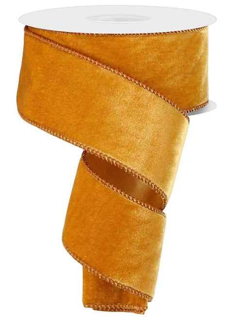 a gold-colored ribbon with a scalloped edge, which is placed on a white background.