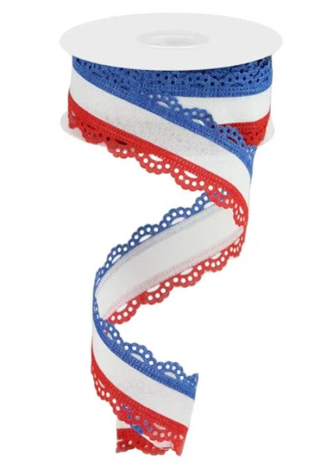A spool of ribbon with a spiral pattern in red, white, and blue colors.
